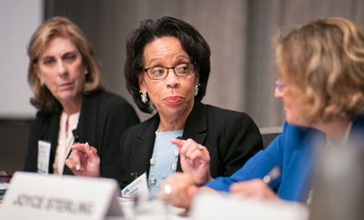 Three women at a table moving the legal system forward — March at IDS Group